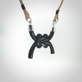 A gorgeous hand carved black jade reef knot pendant with sterling silver. Hand made in Black Jade with Sterling Silver and provided with adjustable cord.